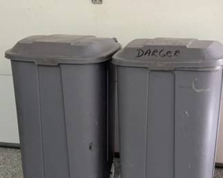 Two Garbage Cans with Lids