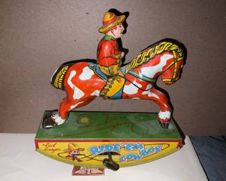 VERY NICE 1930's WYANDOTTE TIN LITHO RED WIND UP RED RANGER RIDE'EM COWBOY #3  Valued at $100.  Sale price: $60.00