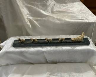 Ivory carved sled dogs artwork