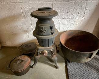 053: Cast-Iron Parlor Stove, Extra Large Pot, and Kettles