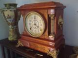 Seth Thomas cherry mantel clock with marble columns and lion's heads in brass. Similar ones are listed in the well known live auction site as sold for up to $250.
