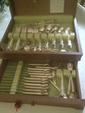 Silver plated Rogers & Co. flatware for 12 listed on the well known live auction site for up to $300