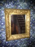 Small gold-gilted mirror