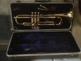 Conn trumpet in Conn case (quite worn case)