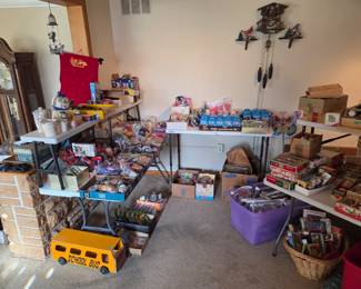 Living room filled with boxes of all the McDonalds, Wendys, Burger King Toys still in there packaging, and lots of mail in Premium toys from Kellog and Beans Rabbits and so much more