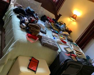 King size bed with two twin mattresses, suitcases, hamper, etc. 
Bed is part of a set by Bassett