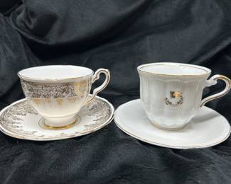 Royal Stafford gold and white tea cup & Saucer,  $7.  "White Star Line" teacup - reproduction Titanic artifact tea cup & saucer,  $20 