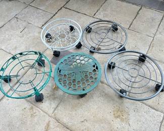 Rolling plant caddies, $9 each.  Green dragonfly metal plant caddie, $12