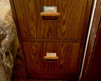 two-drawer, vertical, wood filing cabinet.
