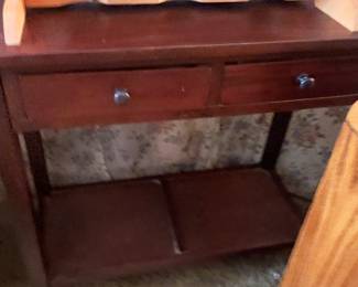 wood console table finished with a dark stain