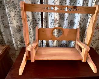 miniature wooden indoor porch swing.