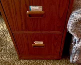 two-drawer, vertical, wood filing cabinet.