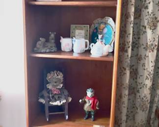 narrow wooden bookcase.
Mouse collection