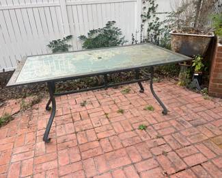 Glass top metal patio table
