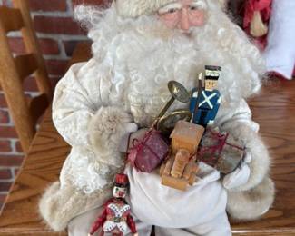 Vintage Santa Claus Figurine with Toy Assortment