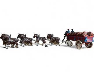 Vintage cast-iron horse-drawn beer wagon