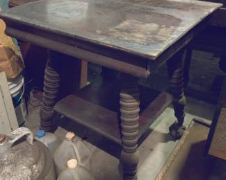 antique parlor table with claw and glass feet