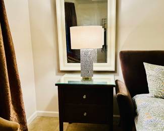 End table and lamp.  Framed mirror.