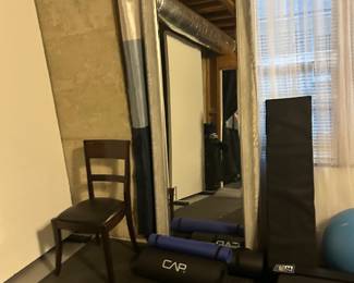 Gym gear and large framed mirror