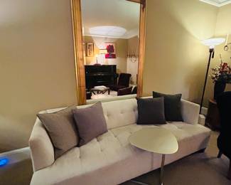 Sofa, large framed mirror, decor