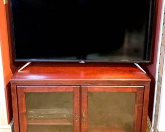 TCL Roku Tv And Wooden Tv Stand