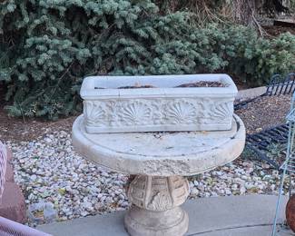 Concrete table and planters. 