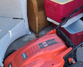 Lawn mower. wicker patio furniture. Coolers. Vintage bistro chairs. Red retro bar stools. 