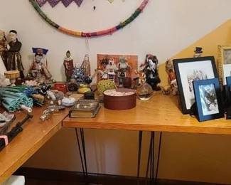 various statues, Chinese figures, painted snuff bottles, glass paper weights, and crafty stuff . A whole table full of picture frames. 