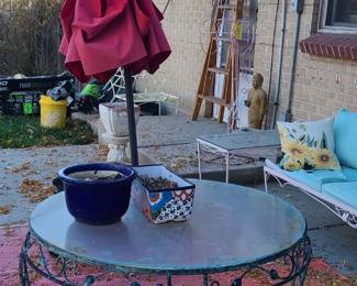 Vintage wrought iron and glass coffee table. Umbrella. Patio set. Yard decorations. Garden supplies. 