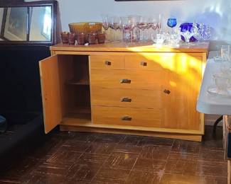 Depression amber punch bowl, glass wear sets, blue crystal bowl and cup, Canada posters, Italian pasta/coffee posters, Mid century dresser. 