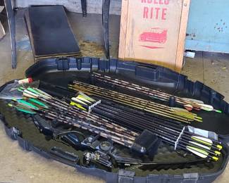 Bow. Roller skates. Camping items. 