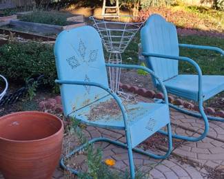 Metal rocking chairs. Large planters with stands. 