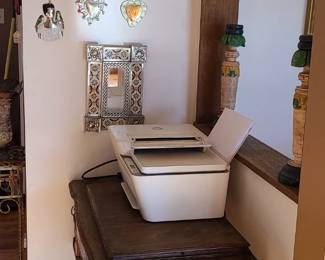 Vintage sewing table. Mexican tin decorations and mirrors. Candle stick holders. 