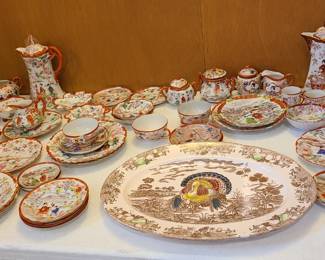 Large grouping of Chinese or Japanese dishes. Thanksgiving turkey dish also. 
