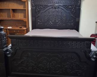 Queen bed. Ornate black wood. Like new mattress and box spring also available.