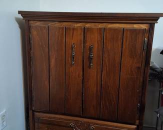 Wood armoire with drawer.