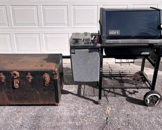 GAS GRILL AND VINTAGE STORAGE TRUNK