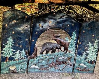 Original Hand painted fireplace screen panels hung from a tree.