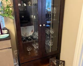 Glass-door cabinet.