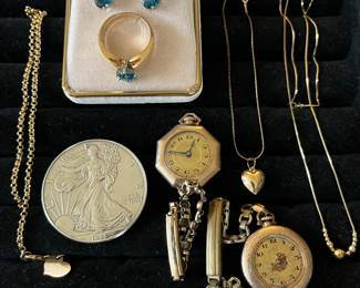 Selection of good, silver, and gold-plate jewelry, including necklaces, vintage pocket watches, and more.