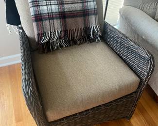 Second of two matching wicker armchairs.