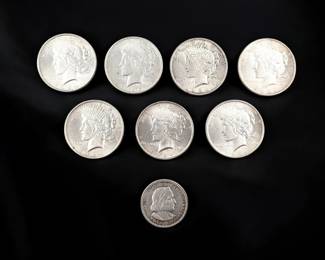 Lot Of 7 1924/1925 Silver Dollars And An 1893 Uncirculated US Columbian Half Dollar, 200g Total