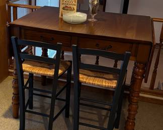 Counter Height Wooden Drop Leaf Table, Pair of Black Ladder Back Counter Stools with Wicker Seats