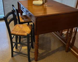 Counter Height Wooden Drop Leaf Table, Pair of Black Ladder Back Counter Stools with Wicker Seats