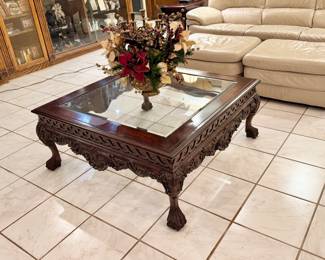 Carved mahogany coffee table