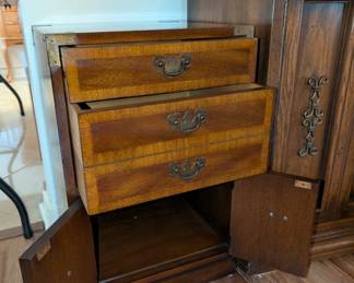 vintage wood campaign-style chest of drawers with brass hardware. 