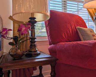 Faux flowers, brass table-lamp, rolling end tables