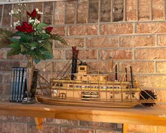 Vintage wooden steamboat model and Star Wars DVD collections