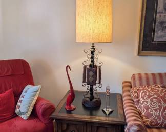 mid-century modern wrought iron table lamp with a cork-textured shade. MCM red bird statue
