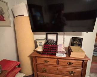 another tall dresser, flat screen TV, rugs, pillows and more